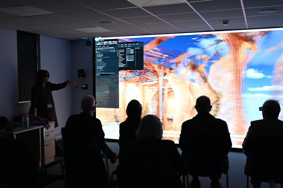 Attendees having a demonstration of the 3D visualisation facility in Keyworth as part of the anniversary celebration. BGS © UKRI.